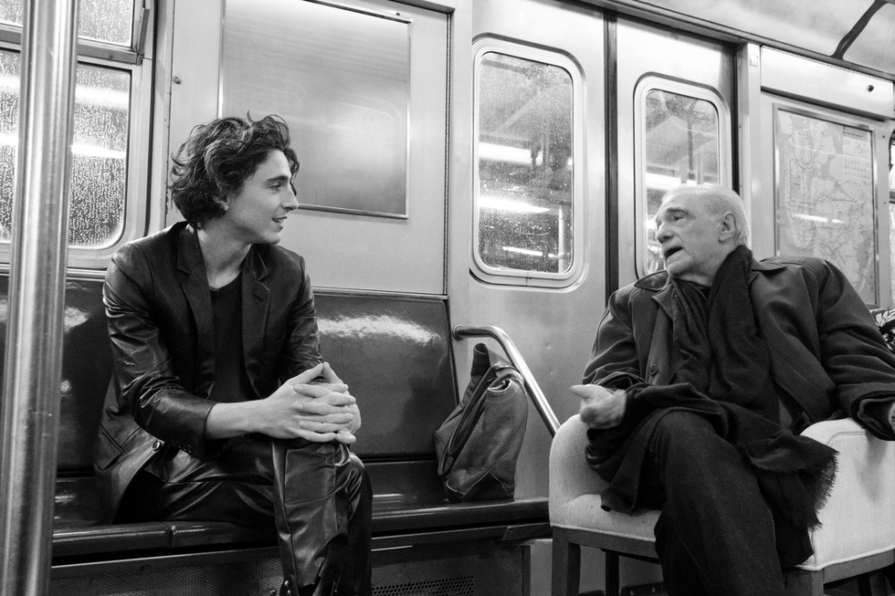 Timothee Chalamet and Martin Scorsese sitting on subway train car 