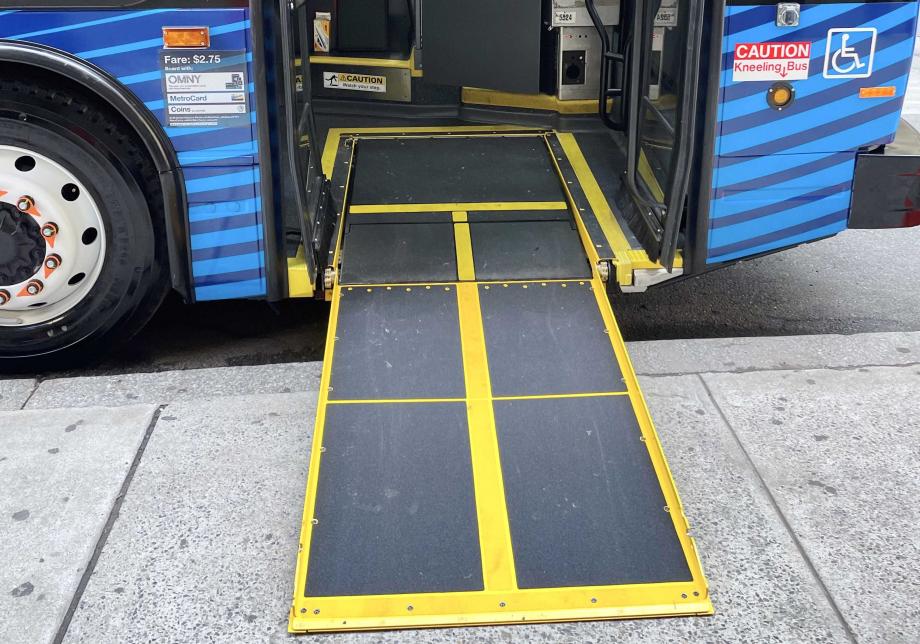 Ramp deployed from front door of us. Includes yellow borders and a yellow line down the middle. 